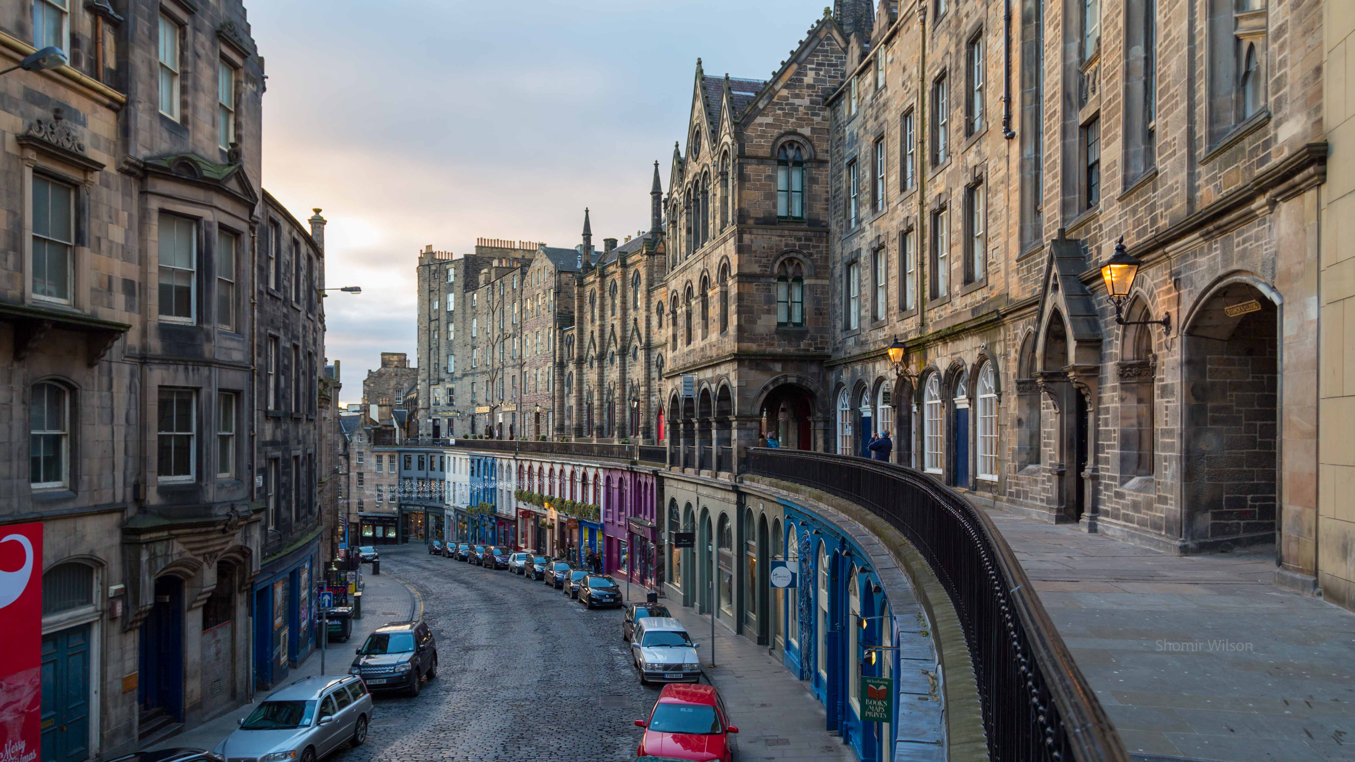 Stone row buildings with a terrace partway up