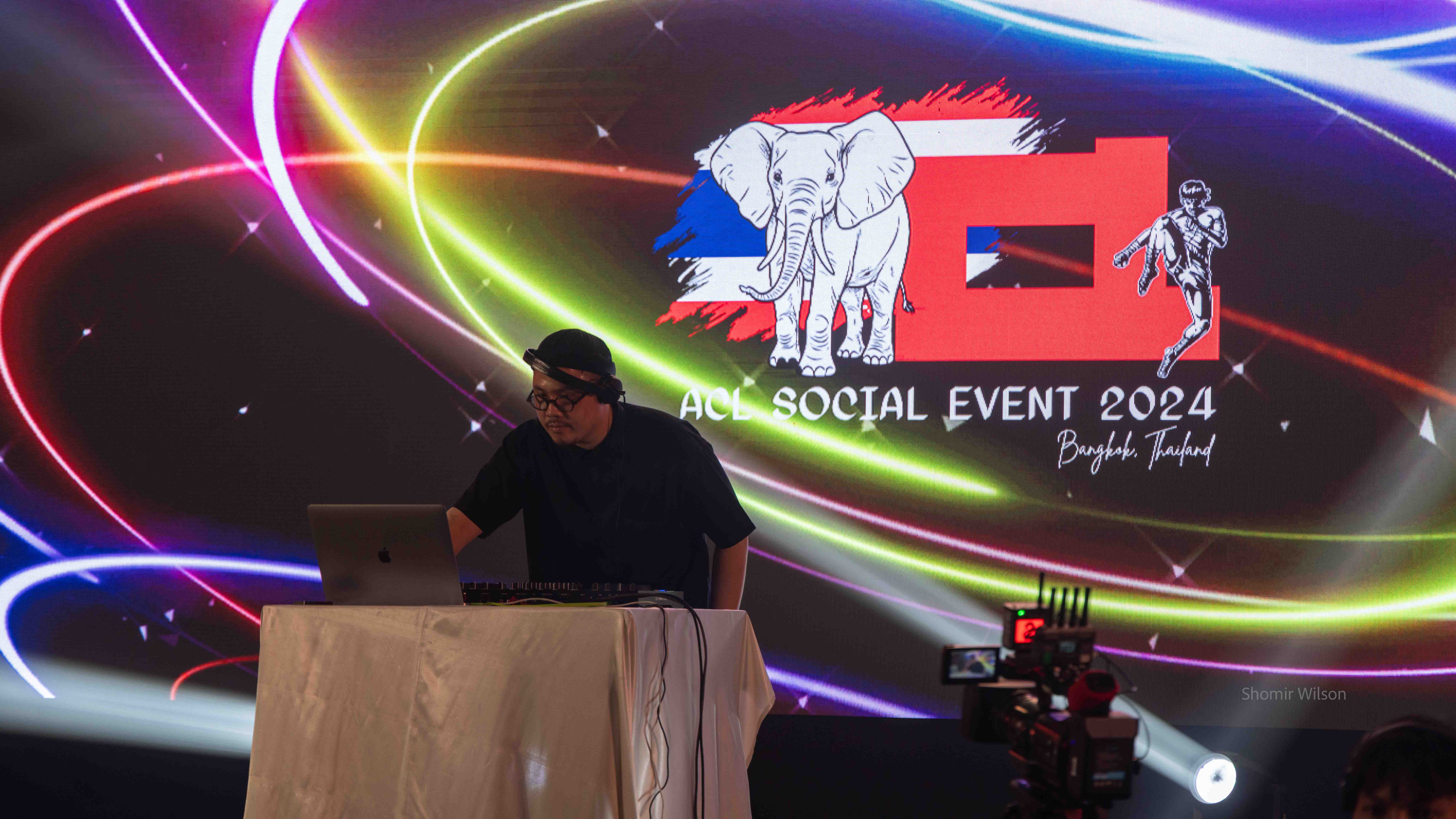 DJ in front of an 'ACL Social event 2024' logo